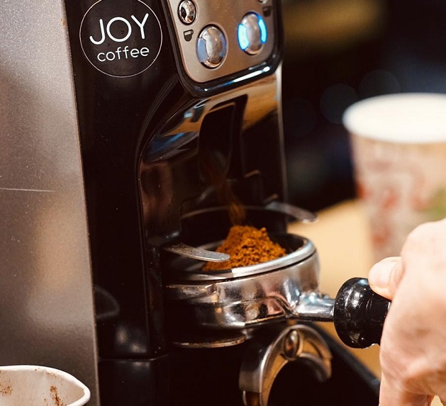 Freshly ground beans at the JOY coffee espresso machine