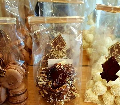 Packaged macarons and pralines in the display case