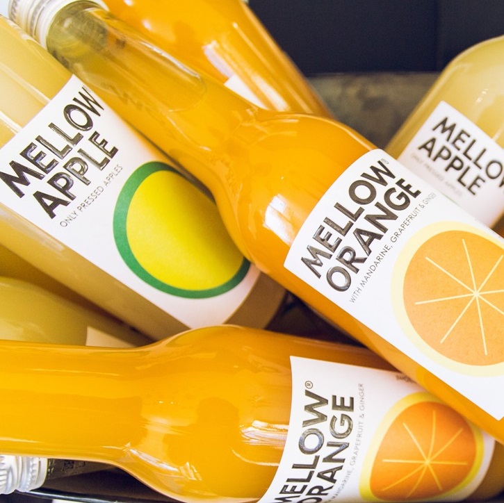 Bottles of Mellow Orange and Mellow Apple juice